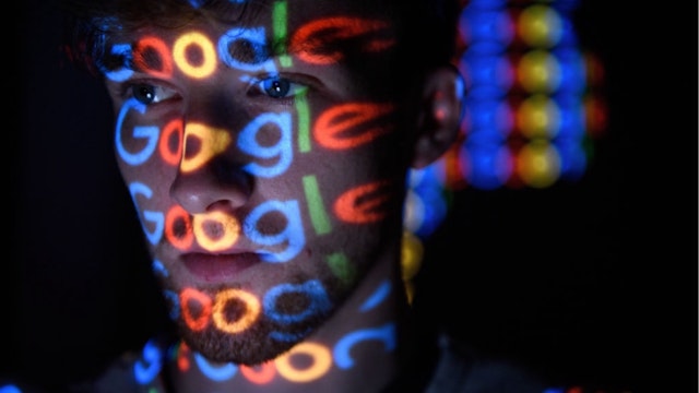 In this photo illustration, The Google logo is projected onto a man on August 09, 2017 in London, England.