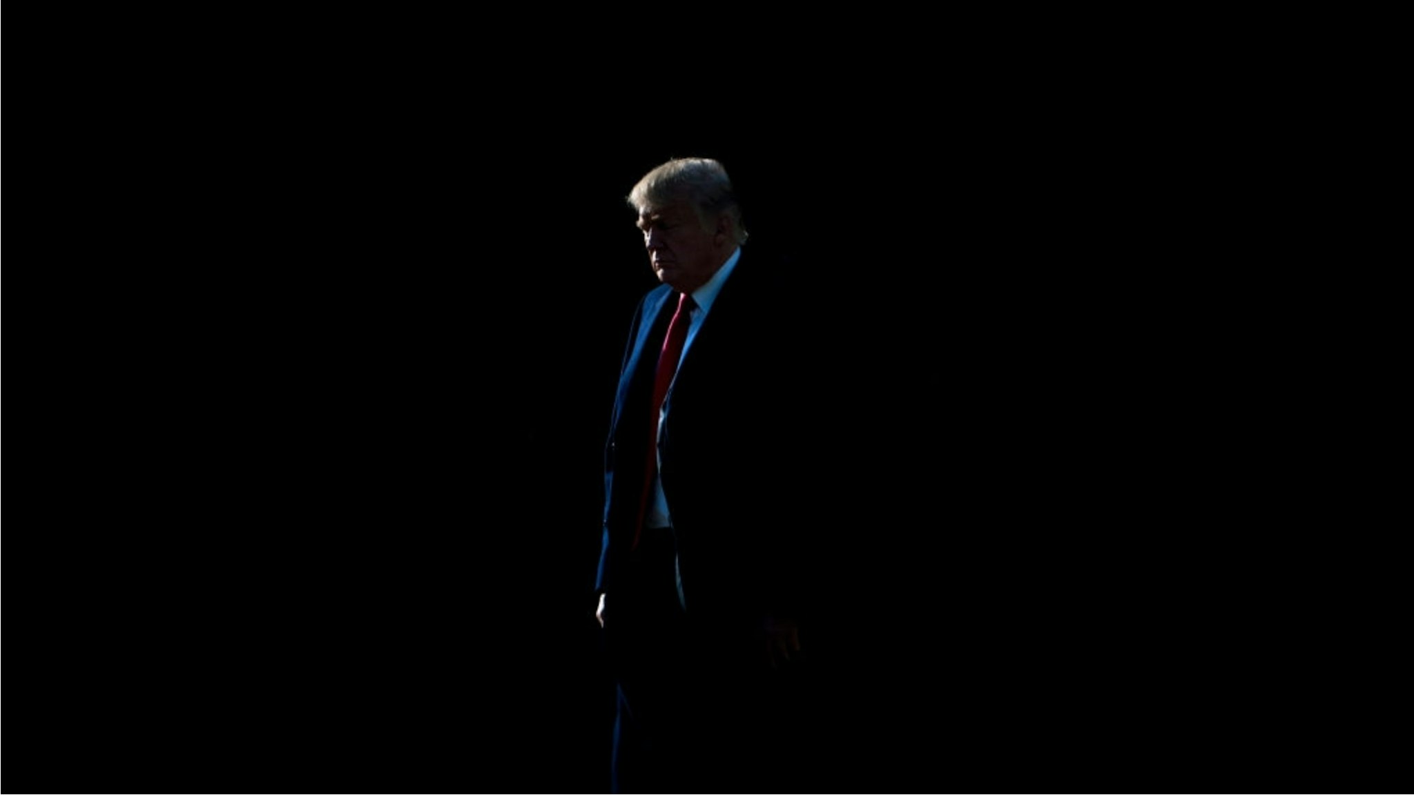 US President Donald Trump walks to Marine One on the South Lawn of the White House December 21, 2017 in Washington, DC.