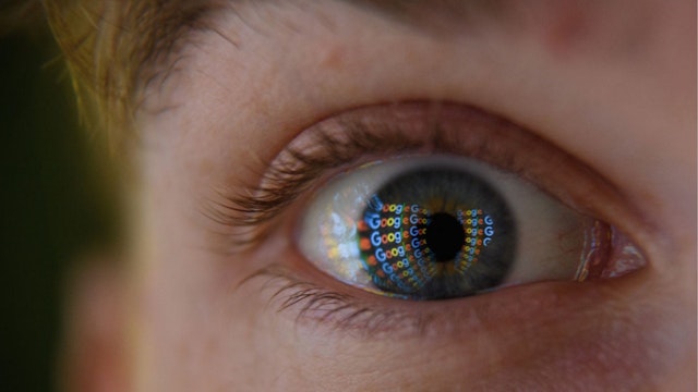 In this photo illustration, an image of the Google logo is reflected on the eye of a young man on August 09, 2017 in London, England.