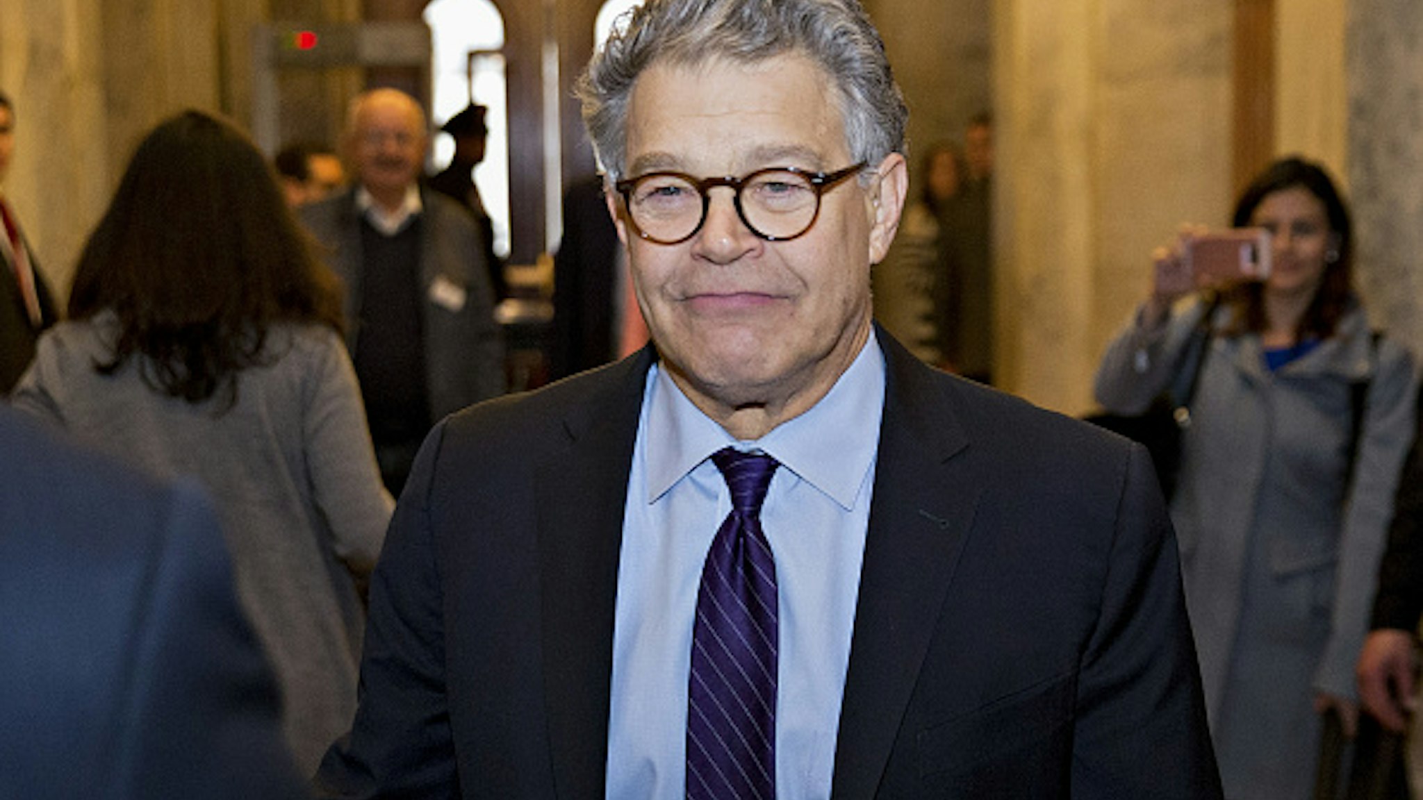 Senator Al Franken, a Democrat from Minnesota, walks through the U.S. Capitol before speaking on the Senate floor in Washington, D.C., U.S., on Thursday, Dec. 7, 2017. Franken announced Thursday hell resign to end the turmoil over allegations that he groped or tried to forcibly kiss several women after more than half of his Democratic colleagues demanded he step down to make clear that mistreatment of women is unacceptable.