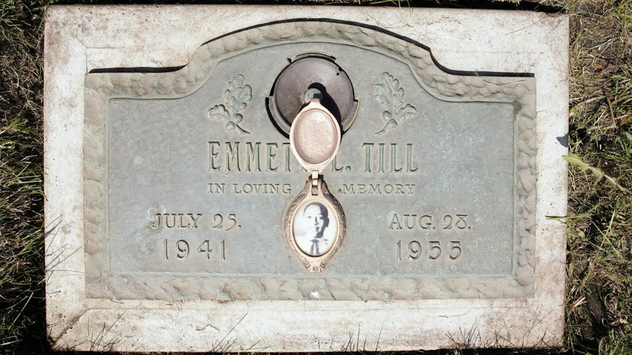 A plaque marks the gravesite of Emmett Till at Burr Oak Cemetery May 4, 2005 in Aslip, Illinois. The FBI is considering exhuming the body of Till, whose unsolved 1955 murder in Money, Mississippi, after whistling at a white woman helped spark the U.S. civil rights movement. (Photo by Scott Olson/Getty Images)