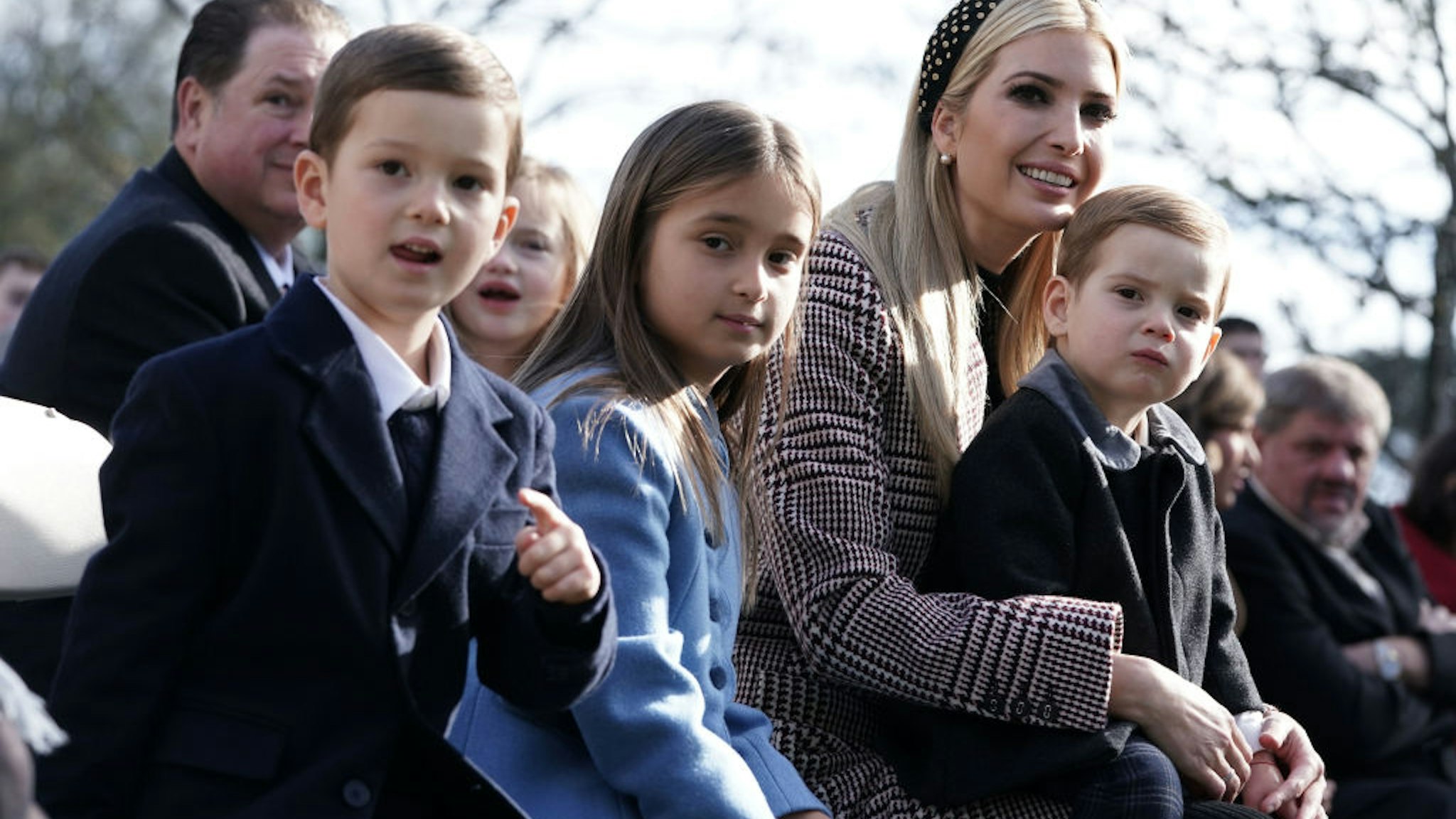 White House adviser and first daughter Ivanka Trump (3rd L), her children Arabella Kushner (2nd L), Joseph Kushner (L), and Theodore Kushner (R) attend a turkey pardoning event at the Rose Garden of the White House November 20, 2018 in Washington, DC.