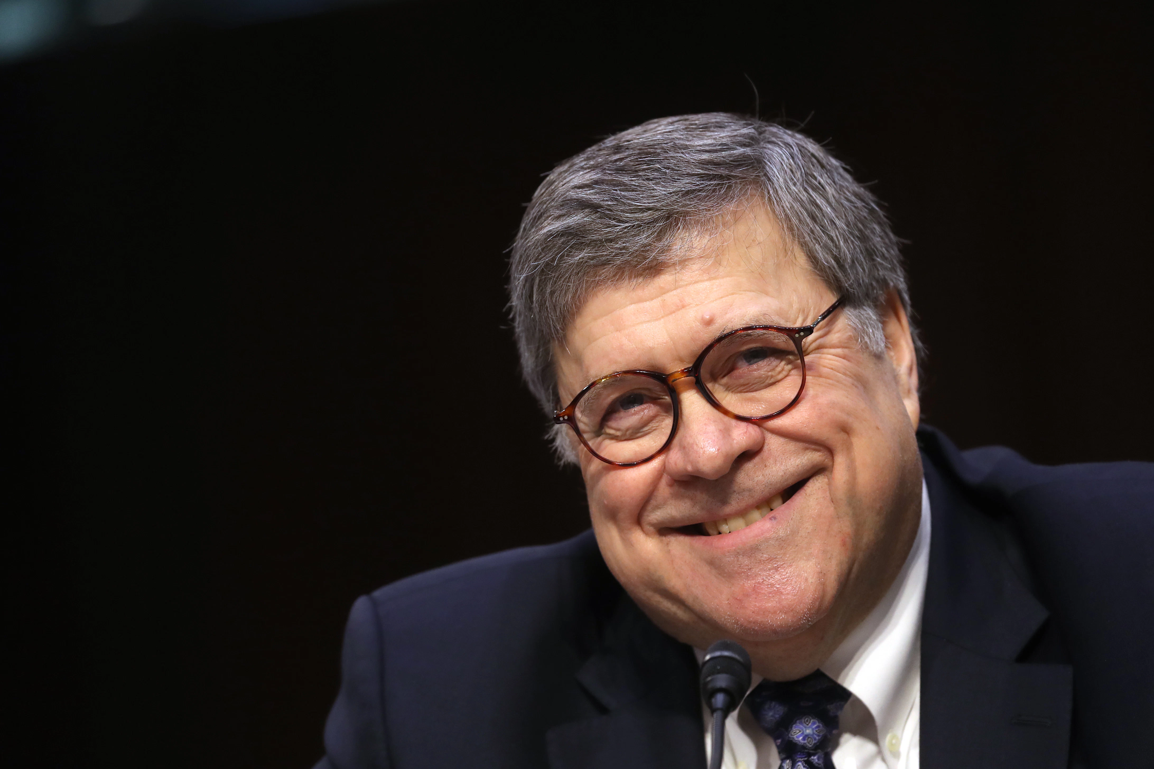 William Barr, attorney general nominee for U.S. President Donald Trump, smiles during a Senate Judiciary Committee confirmation hearing in Washington, D.C., U.S., on Tuesday, Jan. 15, 2019. Barr says he'd let Special Counsel Robert Mueller "complete his work" and that he'd provide Congress and the public as much of the findings in the Russia probe as possible