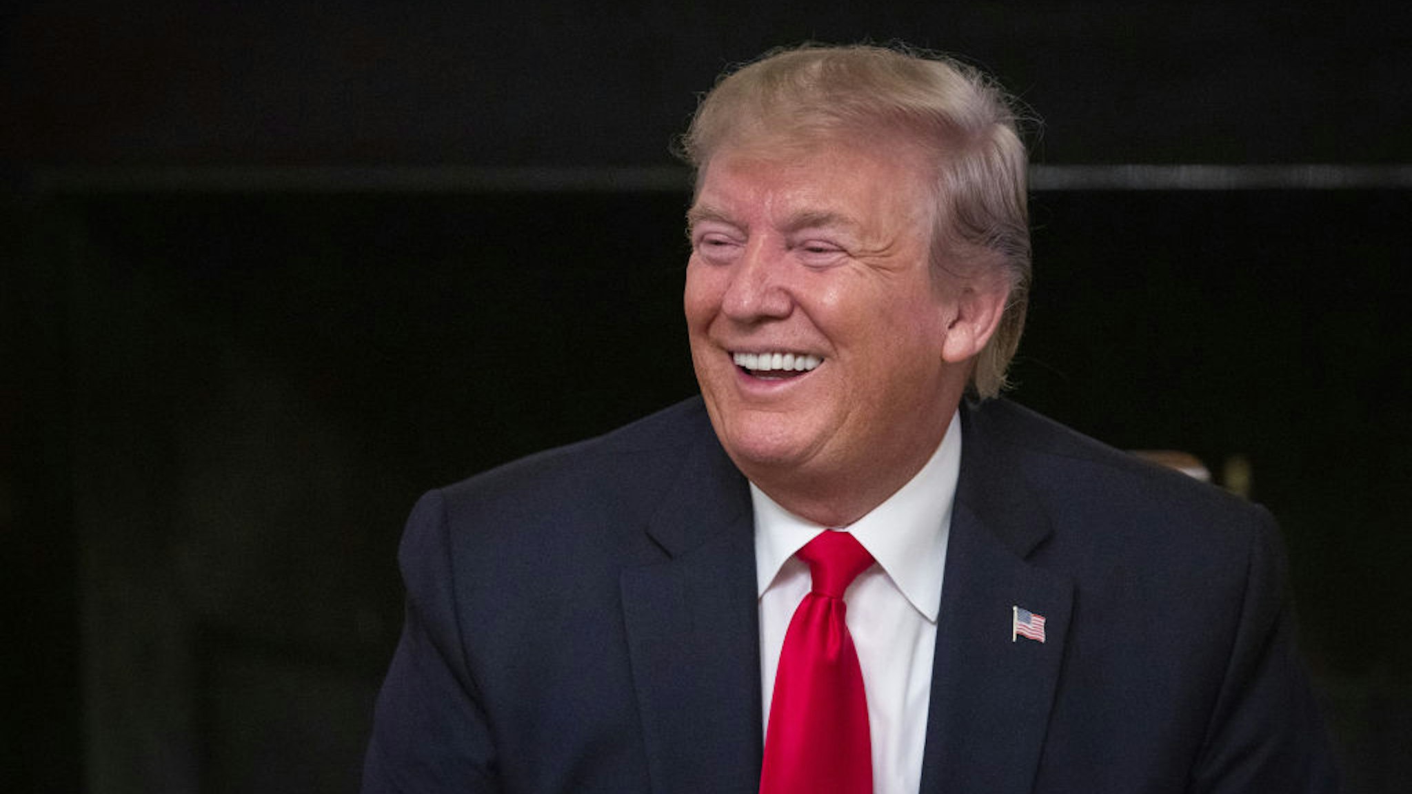 U.S. President Donald Trump laughs during the "Pledge to America's Workers" event at the White House in Washington, D.C., U.S., on Thursday, July 25, 2019.