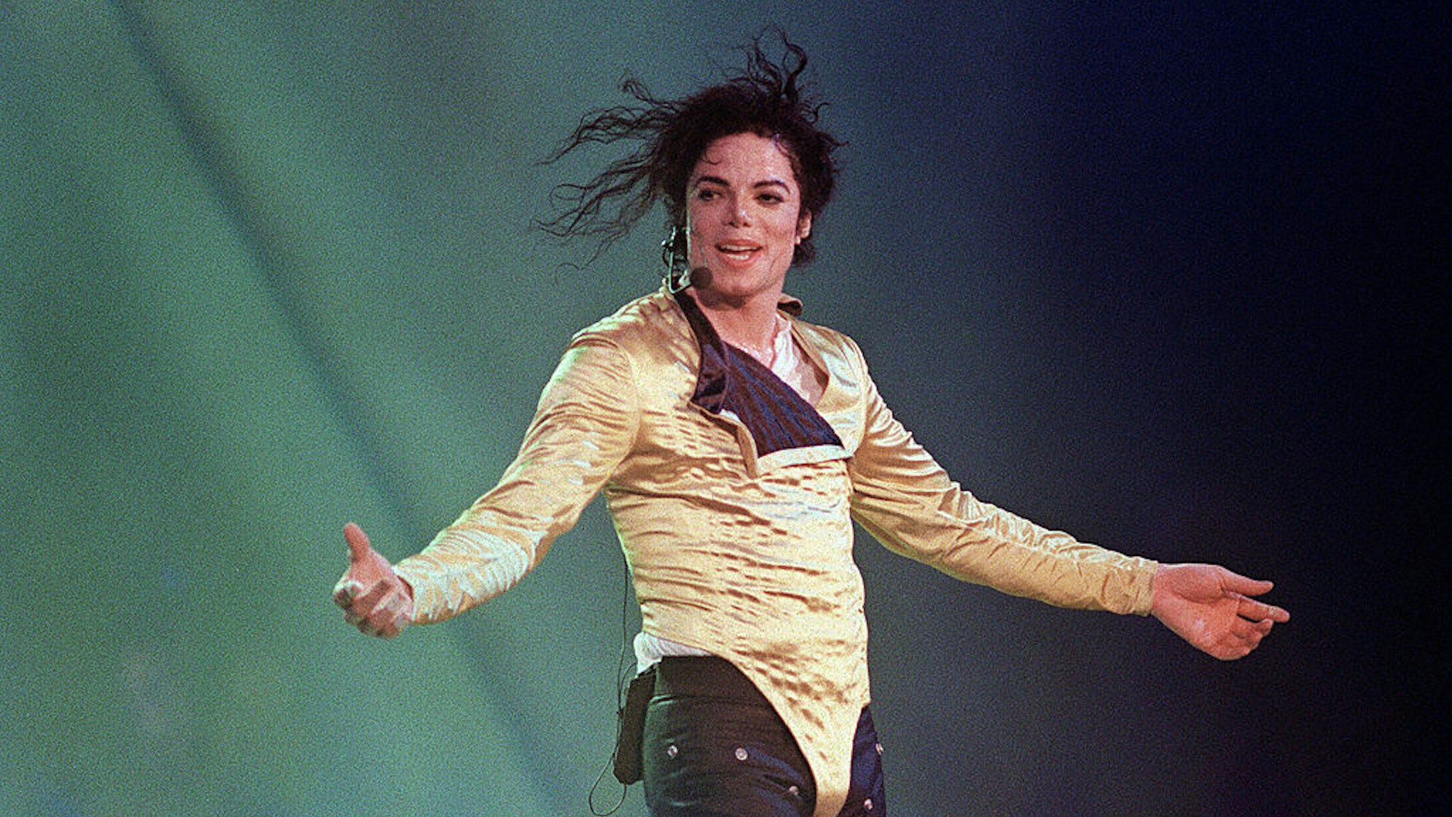 US pop star and entertainer Michael Jackson preforms before an estimated audience of 60,000 in Brunei on July 16, 1996.