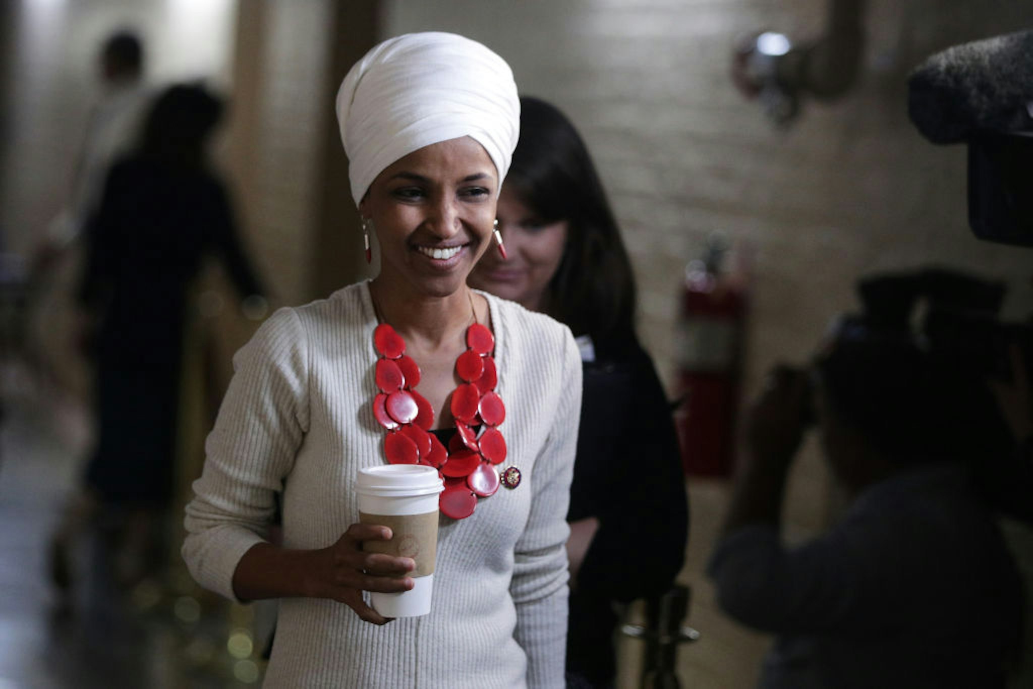 Rep. Ilhan Omar arrives at a House Democratic Caucus meeting at the U.S. Capitol September 25, 2019