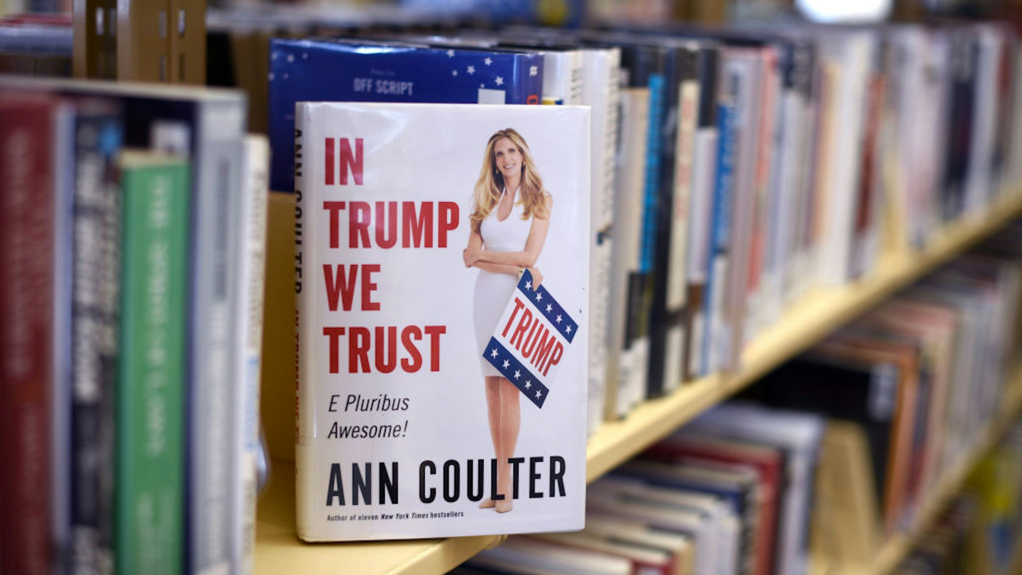 A book by conservative writer Ann Coulter titled 'In Trump We Trust' is among the books available at a public library in Santa Fe, New Mexico. (Photo by Robert Alexander/Getty Images)