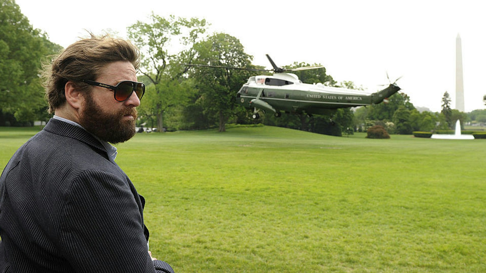 Comedy actor Zach Galifianakis, who recently starred in the movie "The Hangover" witnesses the liftoff of Marine One helicopter, at the White House, bearing U.S. President Barack Obama, in Washington, D.C., May 2, 201,0 on his way to Louisiana, where he will conduct a personal assessment of the aftermath of the explosion of a BP oil rig in the Gulf. (Photo by Mike Theiler/Black Star)