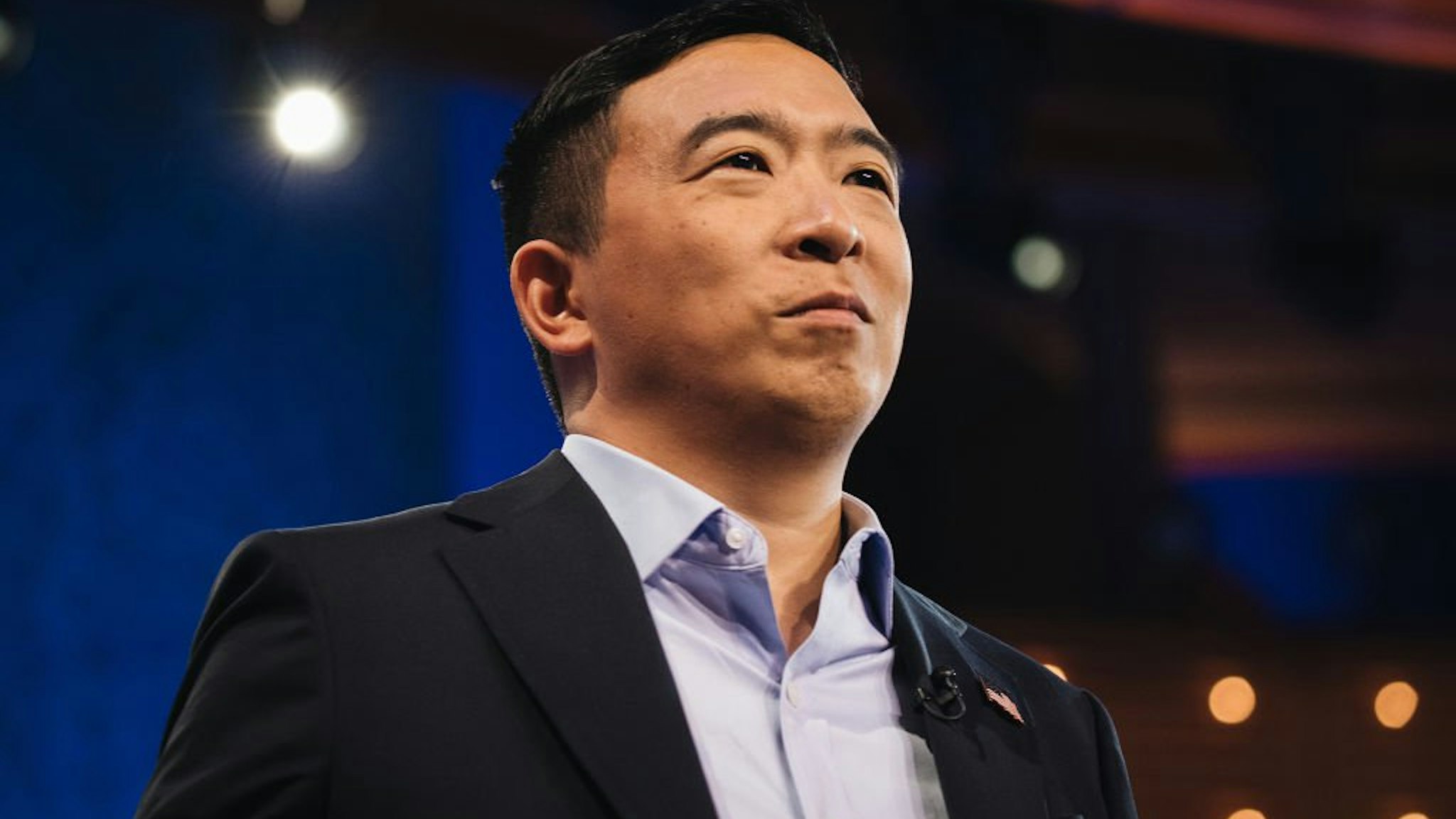 Andrew Yang, founder of Venture for America stands on stage during the Democratic presidential candidate debate