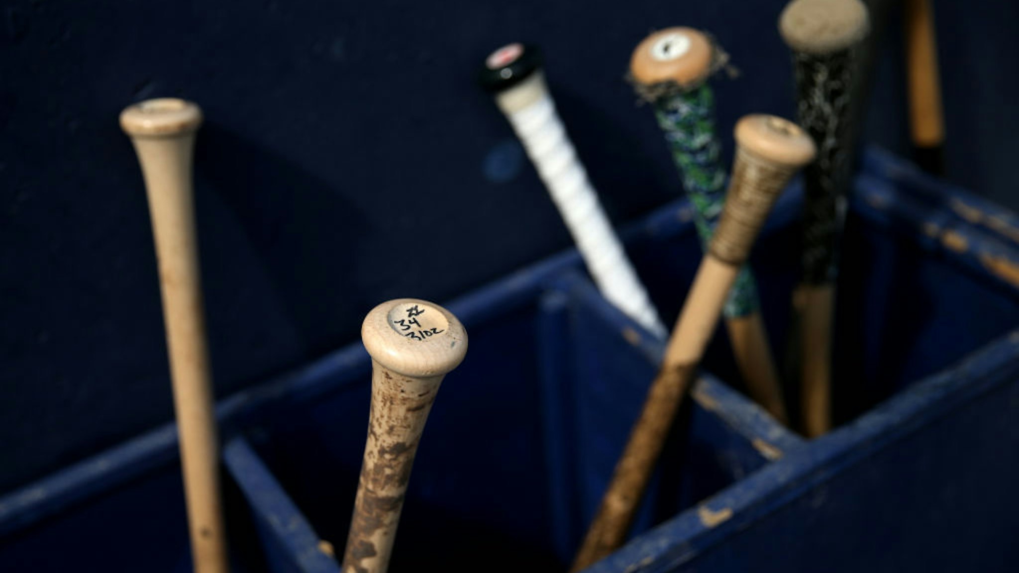 BREWSTER, MA - AUGUST 11: Bats next to the Brewster Whitecaps dugout during game one of the Cape Cod League Championship Series against the Bourne Braves at Stony Brook Field on August 11, 2017 in Brewster, Massachusetts. Cape Cod League games are a popular destination for MLB scouts. The collection of some of the country's top college players combined with the league's use of wooden bats help indicate a prospects success in the big leagues.
