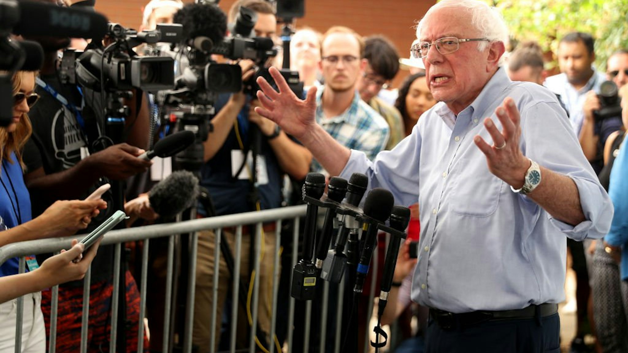 Democratic presidential candidate Sen. Bernie Sanders (I-VT) talks to journalists after speaking at the Des Moines Register Political Soapbox during the Iowa State Fair August 11, 2019 in Des Moines, Iowa.