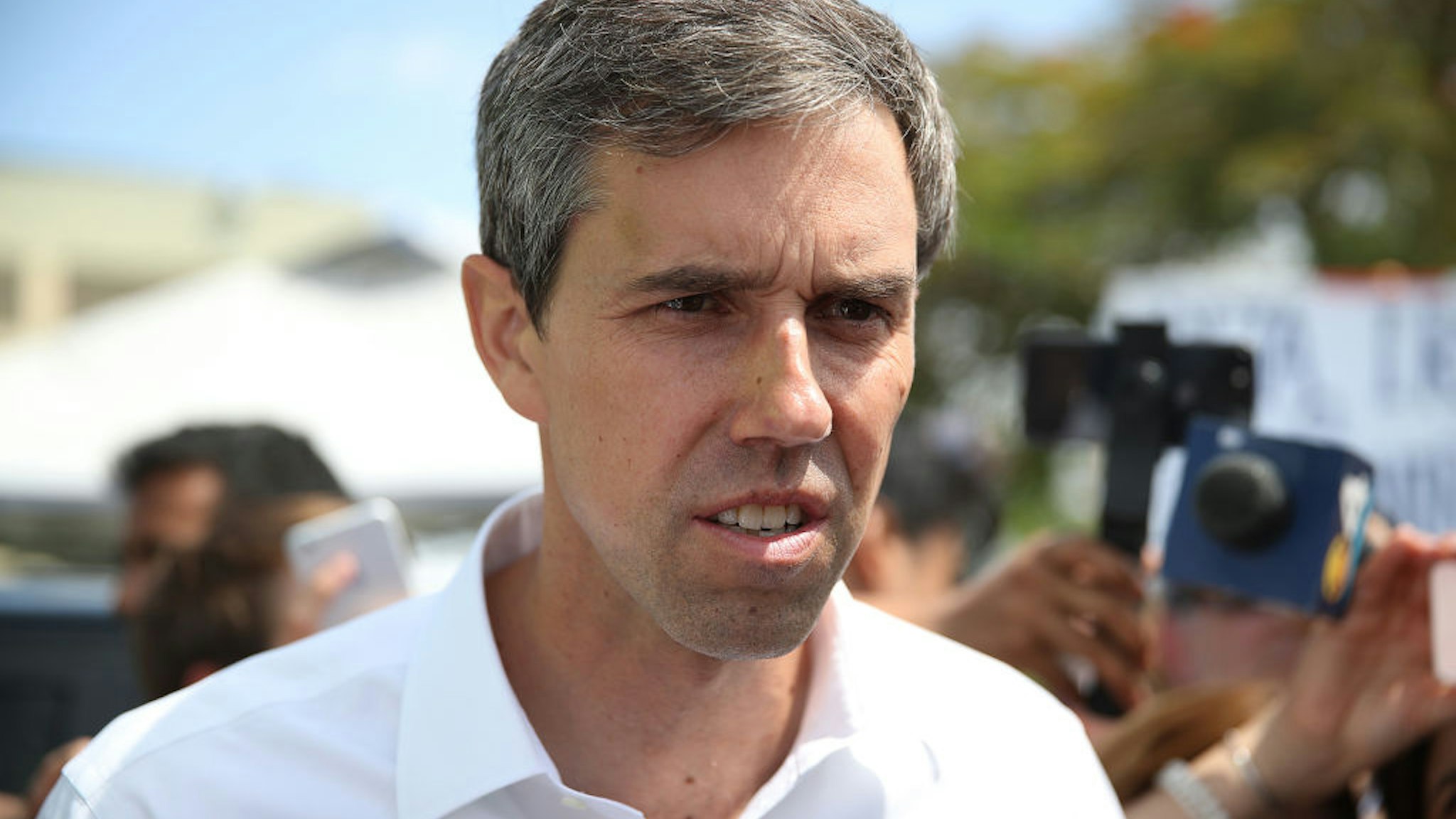 Beto O'Rourke speaks to the media as he visits the outside of a detention center for migrant children
