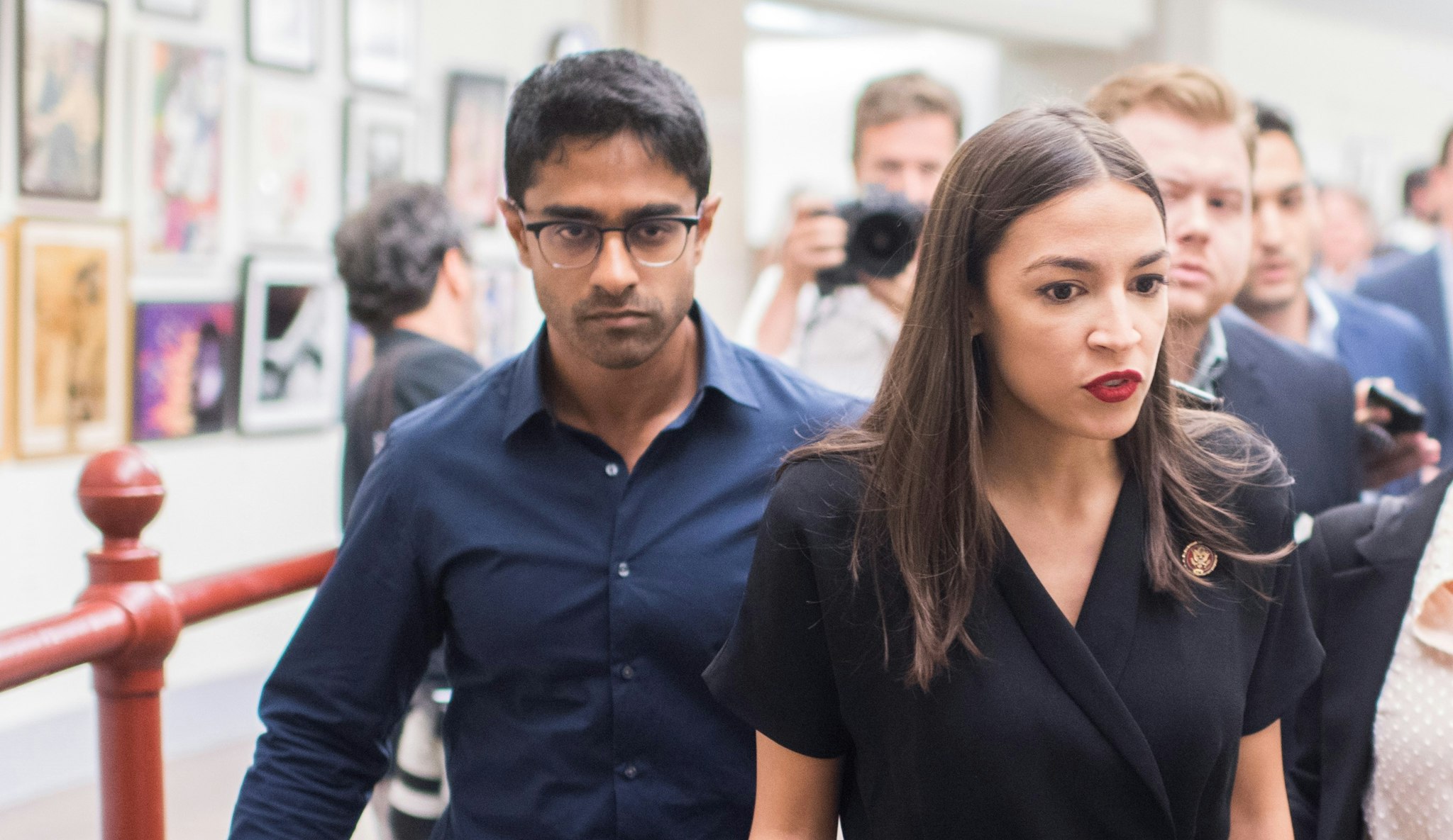 UNITED STATES - JULY 15: Rep Alexandria Ocasio-Cortez, D-N.Y., leaves a news conference in the Capitol Visitor Center after responding to negative comments by President Trump that were directed at the freshman House Democrats on Monday, July 15, 2019. Her chief of staff, Saikat Chakrabarti, appears at left.
