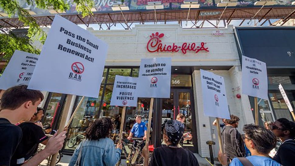 chickfila_0 Protesters targeted Chick-Fil-A for their alleged homophobe stance - some of the banners accused Chick-Fil-A of being anti gay.