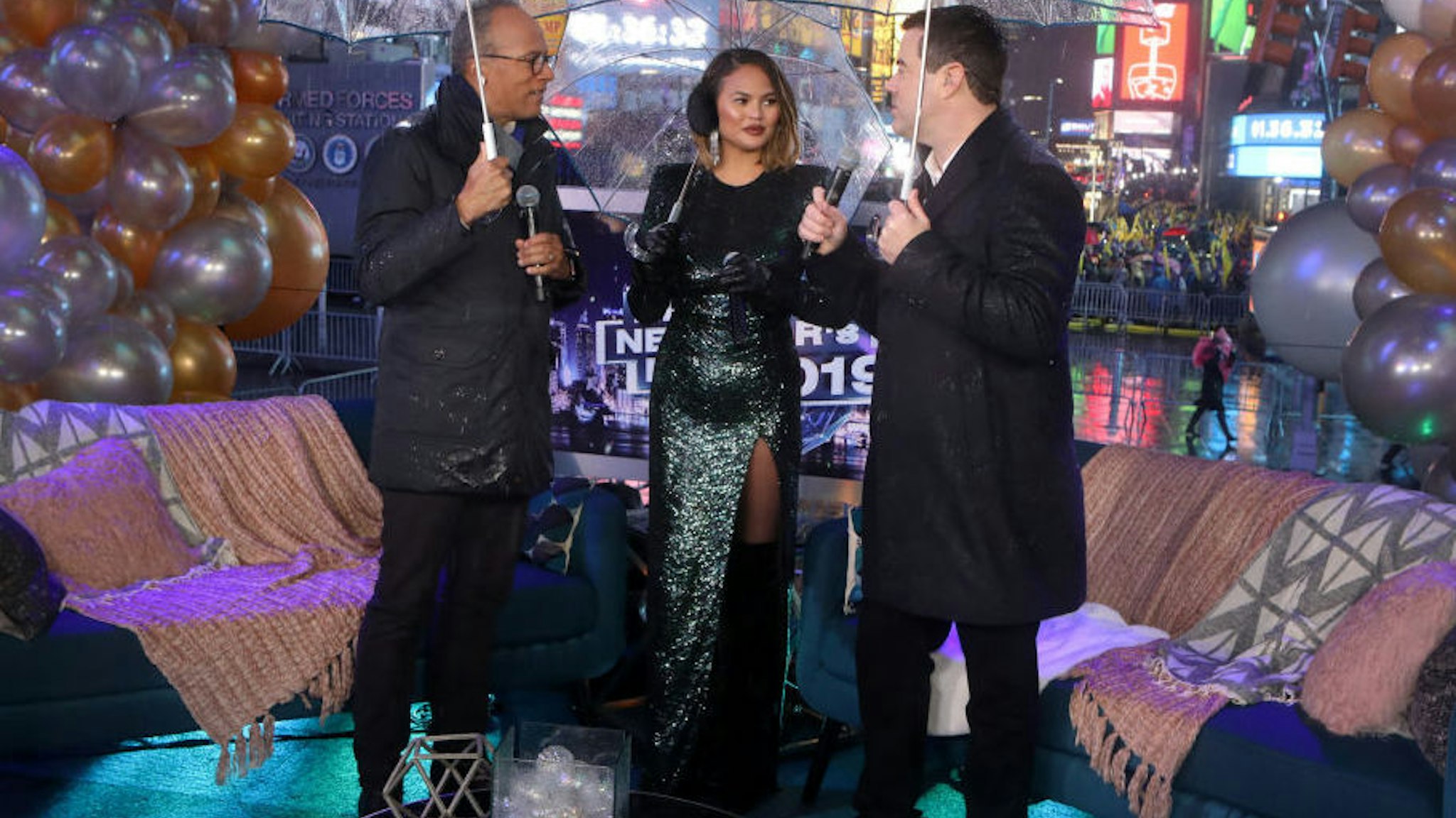 NBC'S NEW YEAR'S EVE -- Pictured: (l-r) Lester Holt, Chrissy Teigen, and Carson Daly during NBC's New Year's Eve --