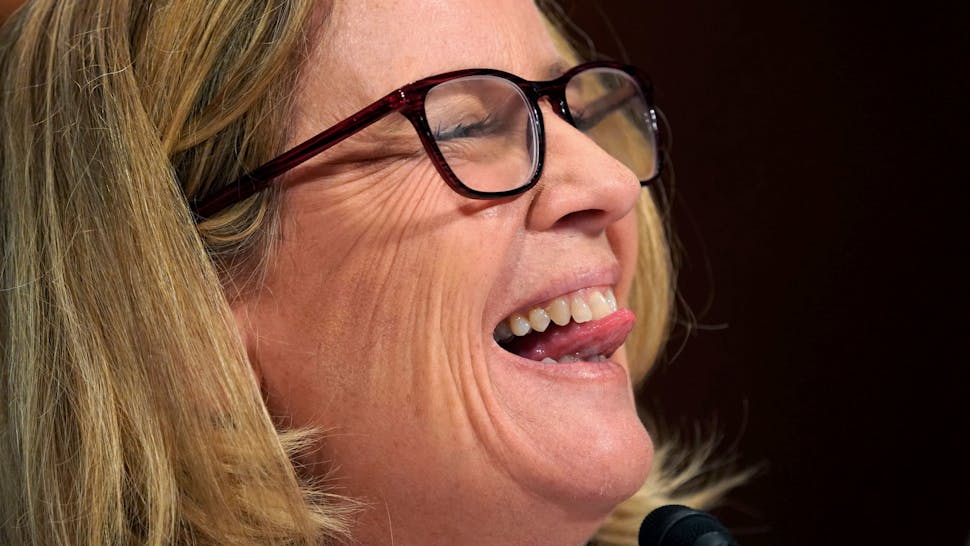 US-COURT-POLITICS-ASSAULT Dr. Christine Blasey Ford speaks before the Senate Judiciary Committee hearing on the nomination of Brett Kavanaugh to be an associate justice of the Supreme Court of the United States, on Capitol Hill in Washington, DC, on 27 September 2018. (Photo by Andrew Harnik / POOL / AFP)
