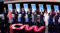 Democratic Presidential Candidates Debate In Detroit Over Two Nights DETROIT, MICHIGAN - JULY 31: Democratic presidential candidates Sen. Michael Bennet (D-CO) (L-R), Sen. Kirsten Gillibrand (D-NY), former housing secretary Julian Castro, Sen. Cory Booker (D-NJ), former Vice President Joe Biden, Sen. Kamala Harris (D-CA) , former tech executive Andrew Yang, Rep. Tulsi Gabbard (D-HI), Washington Gov. Jay Inslee, and New York City Mayor Bill De Blasio take the stage at the Democratic Presidential Debate at the Fox Theatre July 31, 2019 in Detroit, Michigan. 20 Democratic presidential candidates were split into two groups of 10 to take part in the debate sponsored by CNN held over two nights at Detroit’s Fox Theatre. (Photo by Scott Olson/Getty Images)