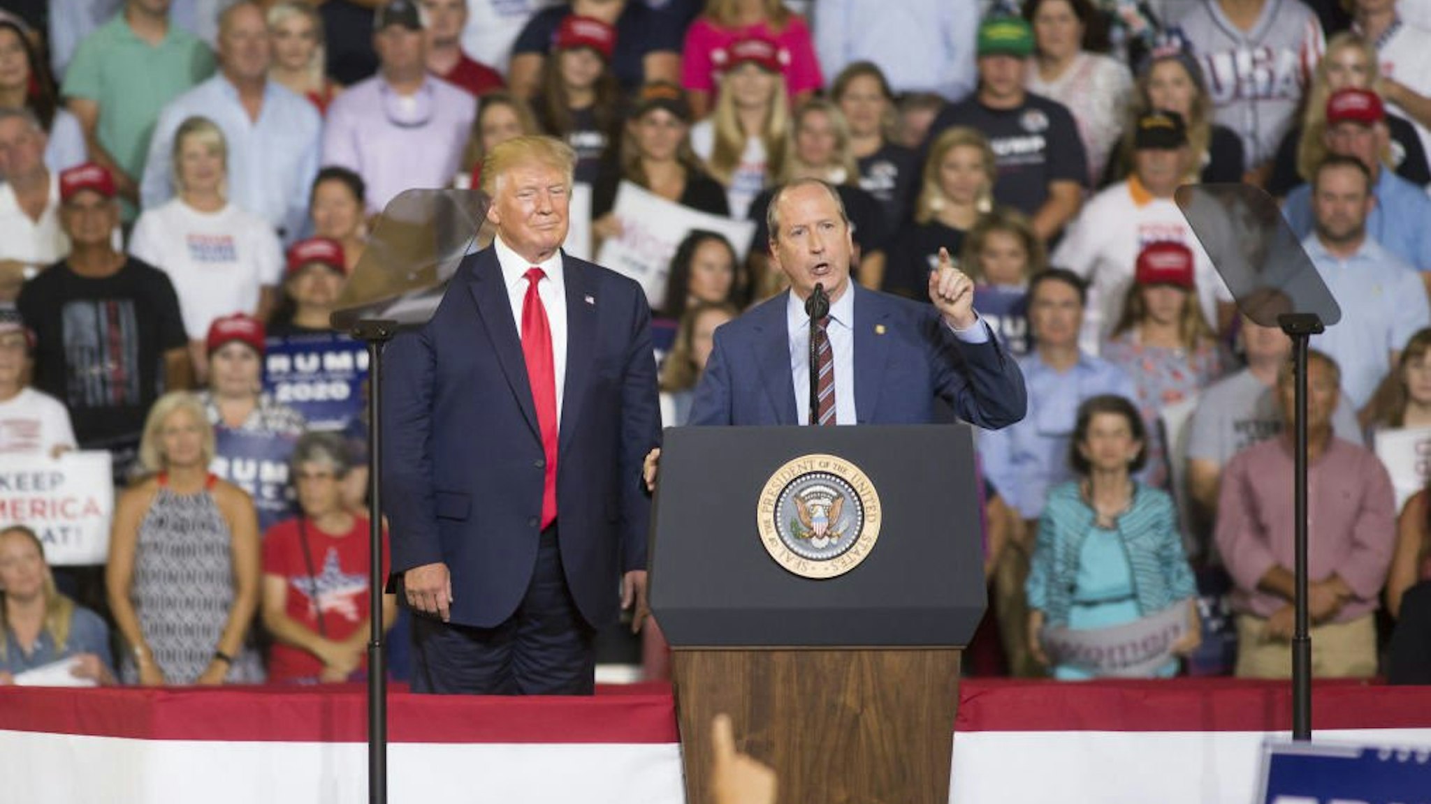 State Senator Dan Bishop, a Republican from North Carolina, speaks during a rally with U.S. President Donald Trump, left, in Greenville, North Carolina, U.S., on Wednesday, July 17, 2019.