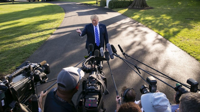 U.S. President Donald Trump speaks to members of the media before boarding Marine One on the South Lawn of the White House in Washington, D.C., U.S., on Friday, Aug. 30, 2019.