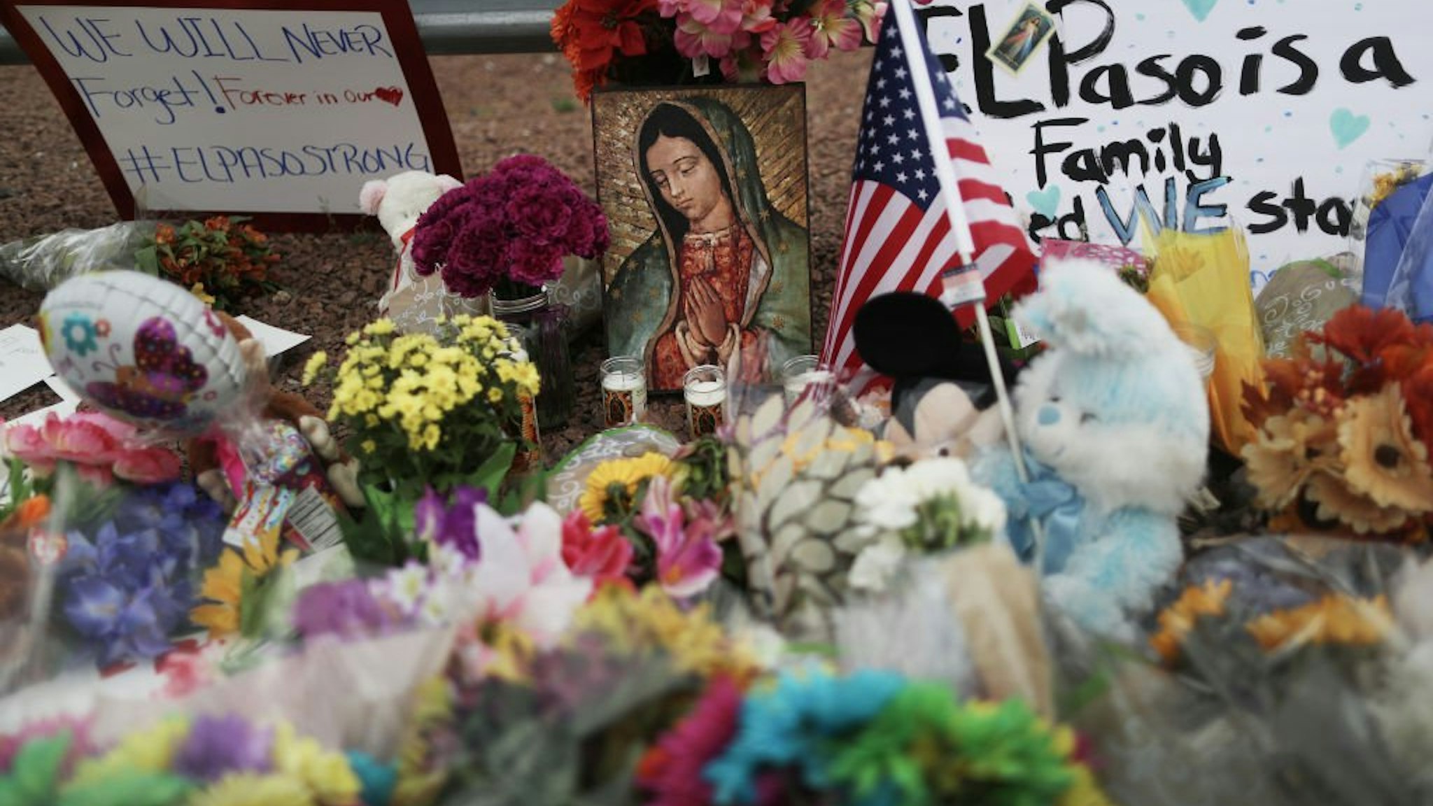 Flowers and mementos are seen at a makeshift memorial outside Walmart, near the scene of a mass shooting which left at least 20 people dead, on August 4, 2019 in El Paso, Texas.