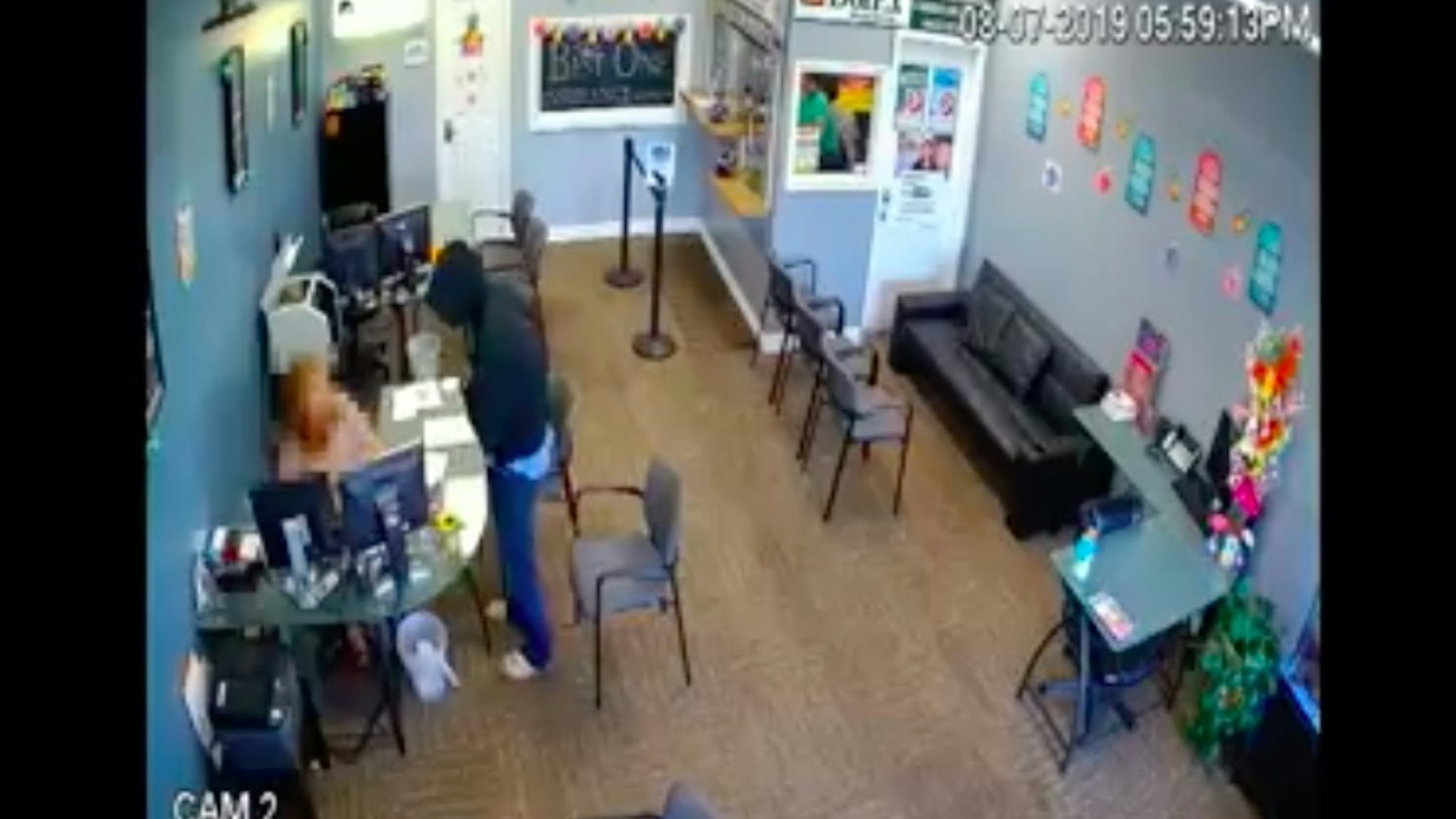 The moment a knife-wielding man attacks an employee of an insurance company.