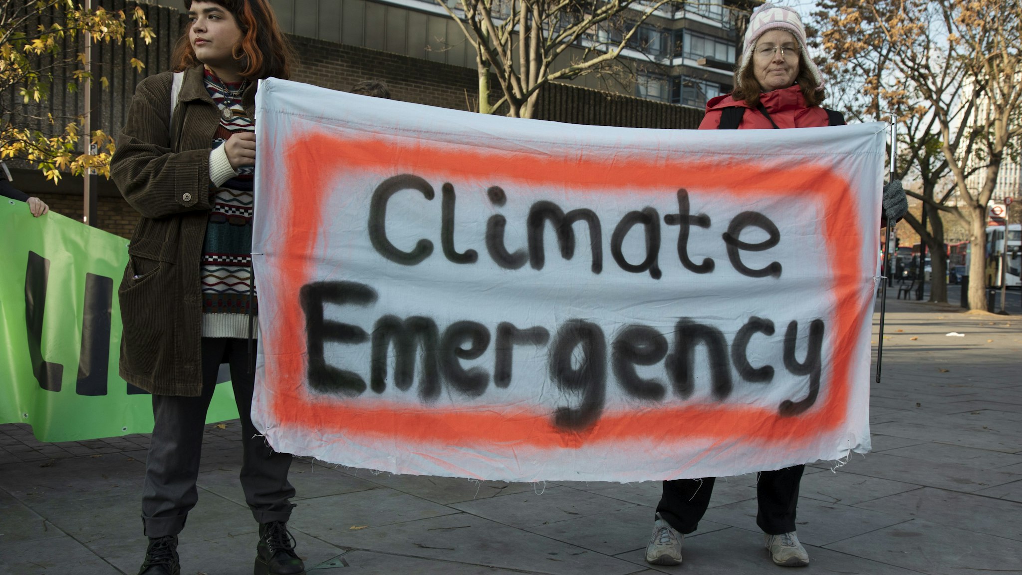 Environmental activists warn about the "climate emergency."