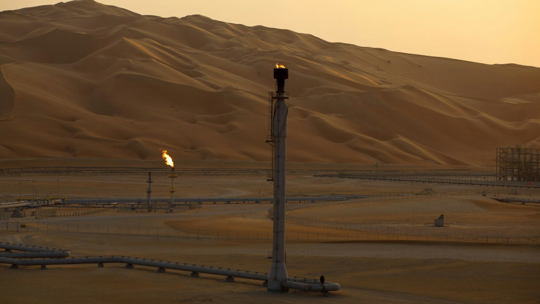 Flames burn off at an oil processing facility in Saudi Aramco's oilfield in the Rub' Al-Khali (Empty Quarter) desert in Shaybah, Saudi Arabia, on Tuesday, Oct. 2, 2018.