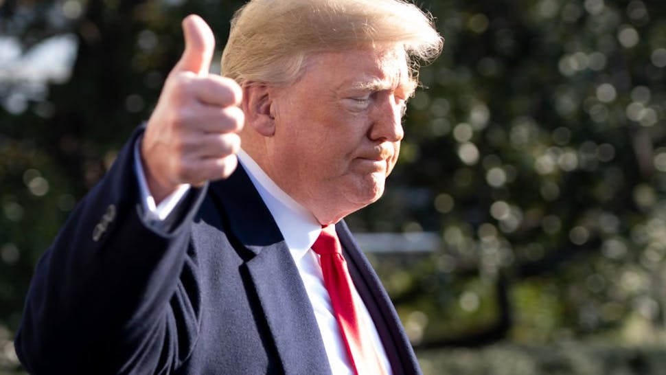 Donald Trump Thumbs Up US President Donald Trump gives a thumbs-up as he speaks to the press as he walks to Marine One prior to departing from the South Lawn of the White House in Washington, DC, December 7, 2018.