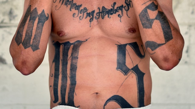 Former MS-13 gang leader Valmis Mejia a.k.a. 'el Bambi', is pictured at Santa Ana prison, 60 km northwest of San Salvador, on May 21, 2019. - Former members of Salvadoran gangs -mostly of the Mara Salvatrucha (MS-13) and Barrio 18- claim to be willing to endure a painful process with laser technology, that can take years, to erase tattoos they now say were a "youth mistake". (