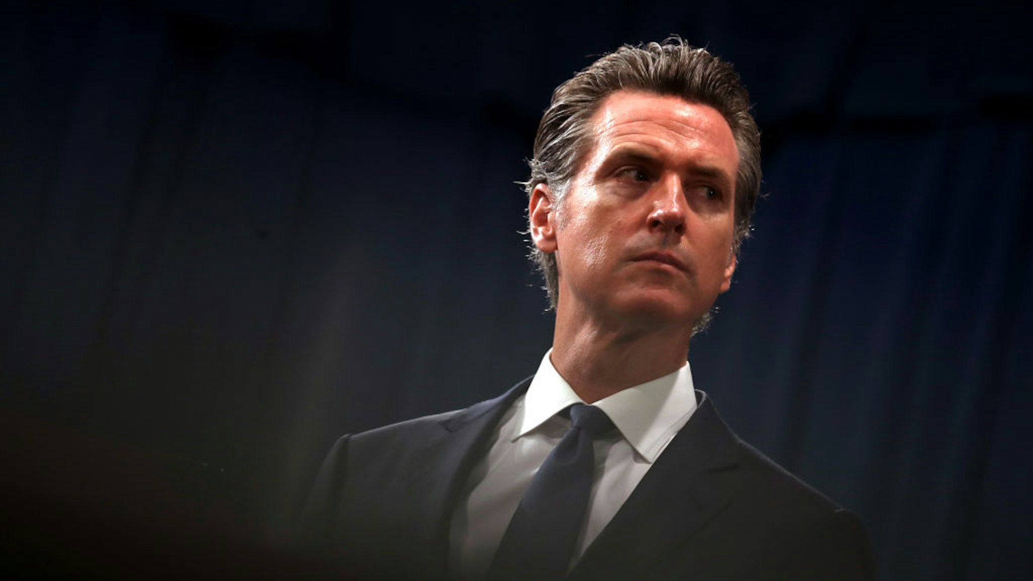 SACRAMENTO, CALIFORNIA - AUGUST 16: California Gov. Gavin Newsom looks on during a news conference with California attorney General Xavier Becerra at the California State Capitol on August 16, 2019 in Sacramento, California. California attorney genera Xavier Becerra and California Gov. Gavin Newsom announced that the State of California is suing the Trump administration challenging the legality of a new "public charge" rule that would make it difficult for immigrants to obtain green cards who receive public assistance like food stamps and Medicaid.