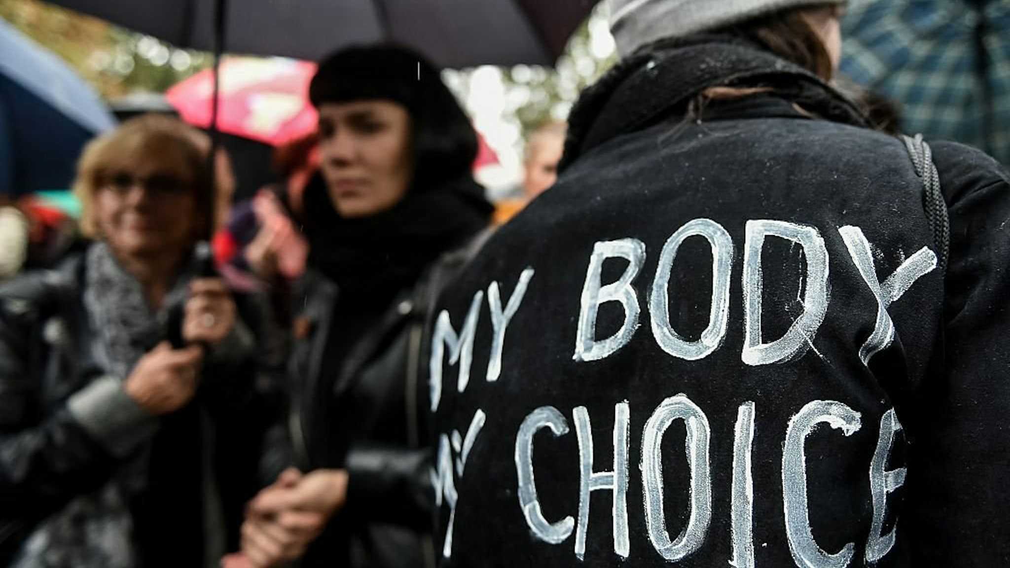 WARSAW, POLAND - OCTOBER 03: (SOUTH AFRICA AND POLAND OUT) Wwoman with an inscription on her jacket "My body, my choice" participates in the Black Monday, a nationwide women's pro-abortion protest on October 03, 2016 at Swietokrzyska Street in Warsaw, Pol