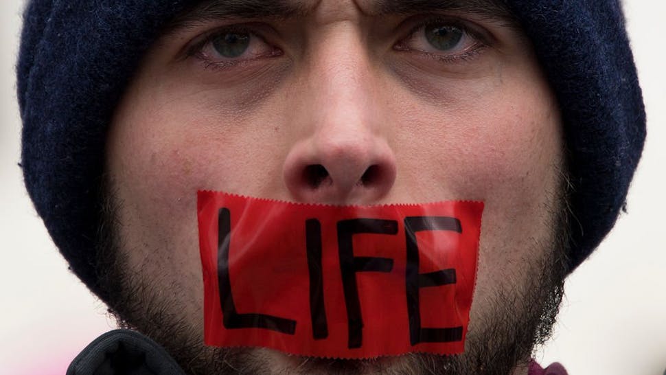 Pro-lifer A man wears tape over his mouth during protests at the 44th annual March for Life on January 27, 2017 in Washington, DC. Anti-abortion activists are gathering for the 44th annual March for Life in Washington, protesting the 1973 Supreme Court decision leg