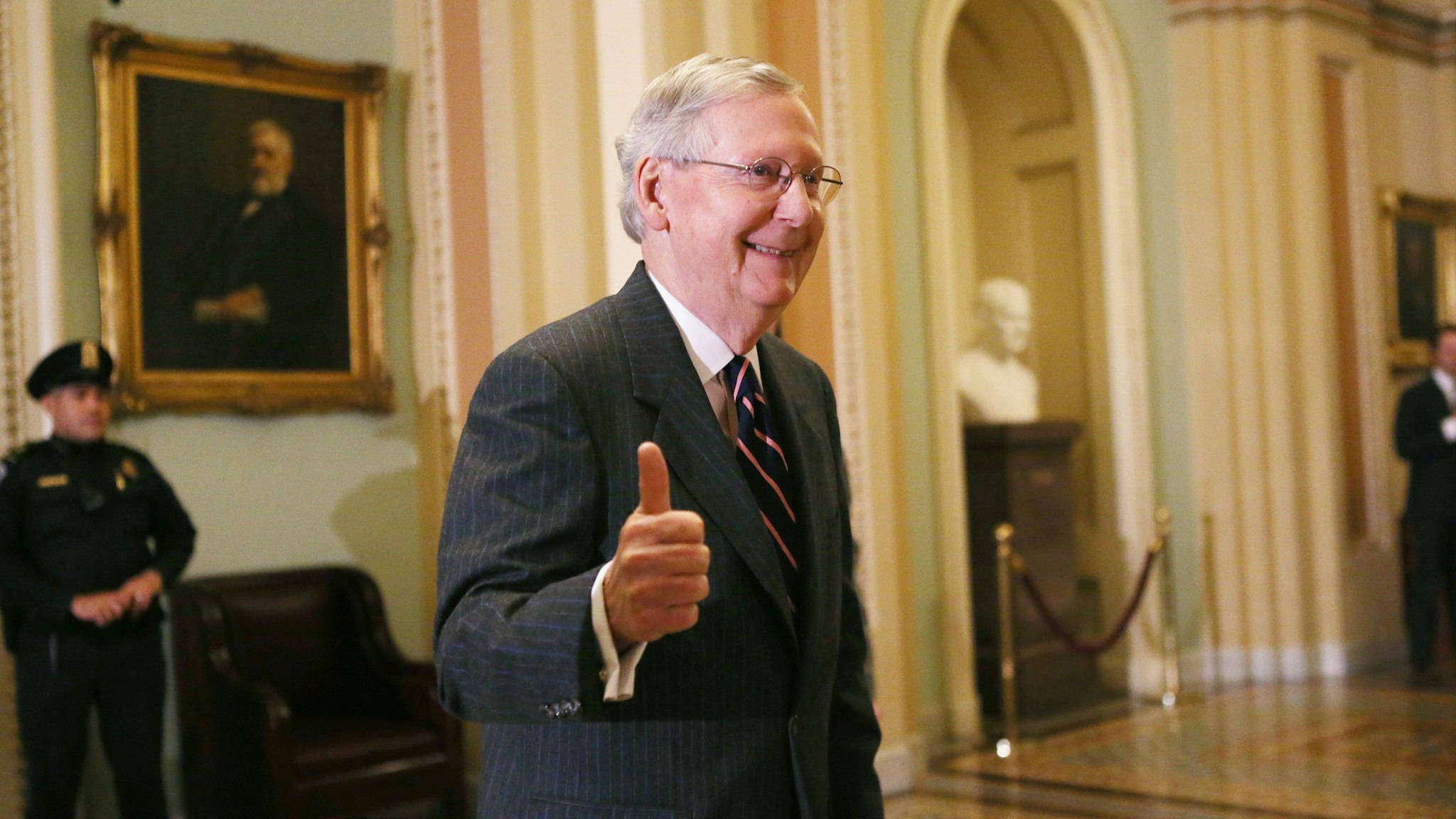 WASHINGTON, DC - FEBRUARY 07: Senate Majority Leader Mitch McConnell (R-KY) gives the thumbs-up to the media after the Senate voted to confirm Betsy DeVos as education secretary on Capitol Hill on February 7, 2017 in Washington, D.C. The historic 51-50 vote was decided by a tie-breaking vote from Vice President Mike Pence.