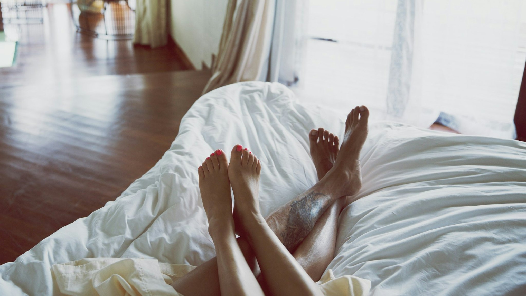 Two people relax in bed