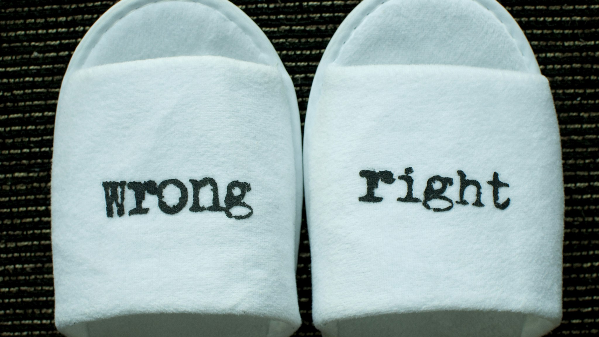 Right and wrong signs on a pair of slippers