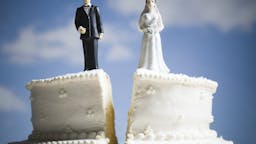 Wedding Cake Wedding cake visual metaphor with figurine cake toppers