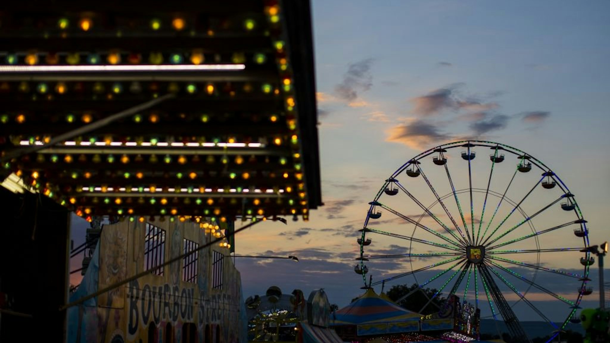 WASHINGTON, USA - SEPTEMBER 15: The sun sets over the amusement rides at The Great Frederick Fair in Frederick, Md., United States on September 15, 2017.