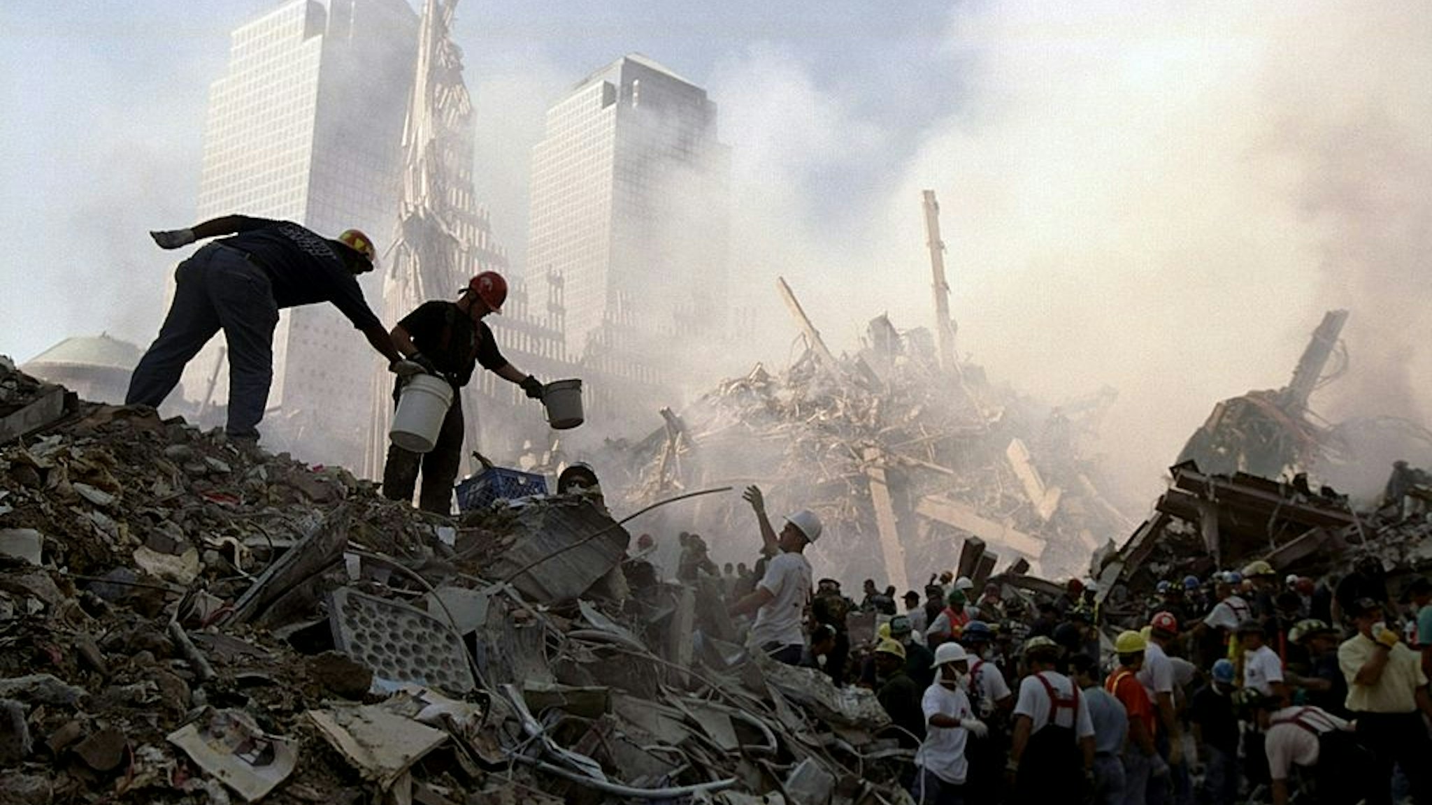 UNITED STATES - SEPTEMBER 13: Rescuers work to free a victim from under the rubble at the site of the World Trade Center, demolished in a terrorist attack.