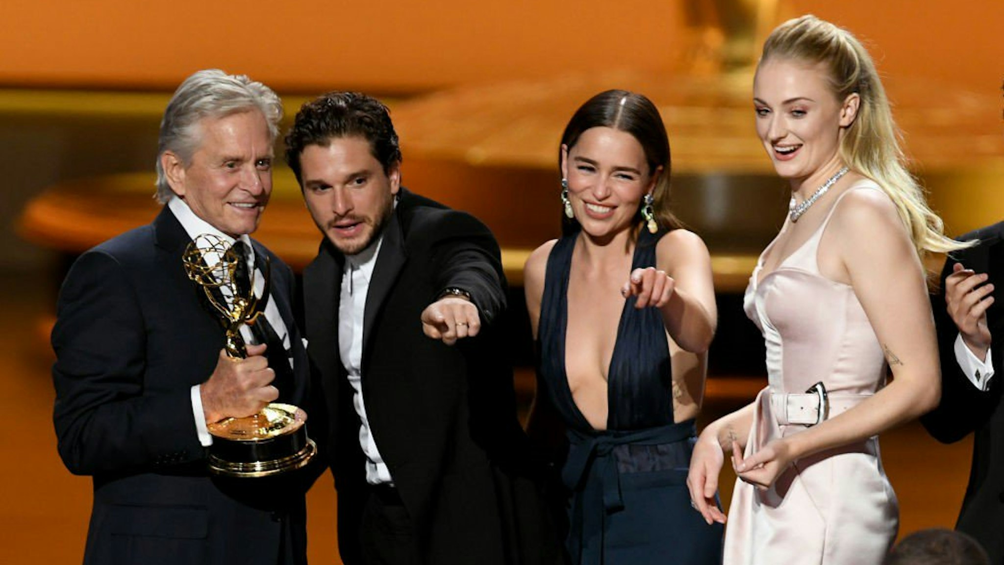 "Game of Thrones" actors celebrate on stage.