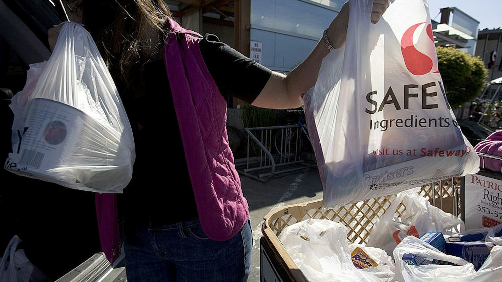 A Woman Buys Groceries In San Francisco In June 2007