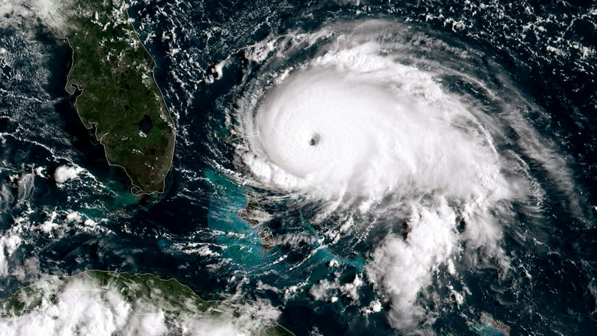 ATLANTIC OCEAN - SEPTEMBER 1: In this NOAA GOES-East satellite handout image, Hurricane Dorian, now a Cat. 5 storm, tracks towards the Florida coast taken at 13:20Z September 1, 2019 in the Atlantic Ocean. A hurricane warning is in effect for much of the northwestern Bahamas as it gets hit with 175 mph winds. According to the National Hurricane Center Dorian is predicted to hit the U.S. as a Category 4 storm.