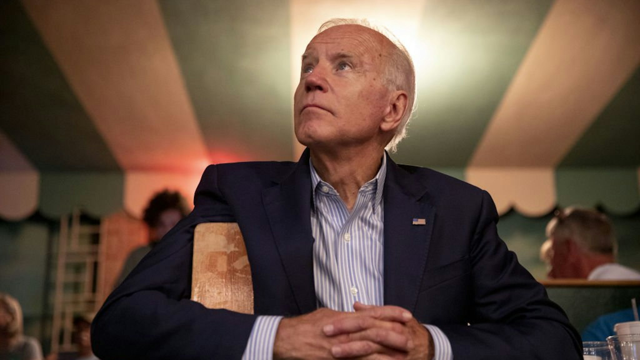 Former U.S. Vice President Joe Biden, 2020 Democratic presidential candidate, listens during a video presentation at the Democratic Wing Ding event in Clear Lake, Iowa, U.S., on Friday, Aug. 9, 2019.