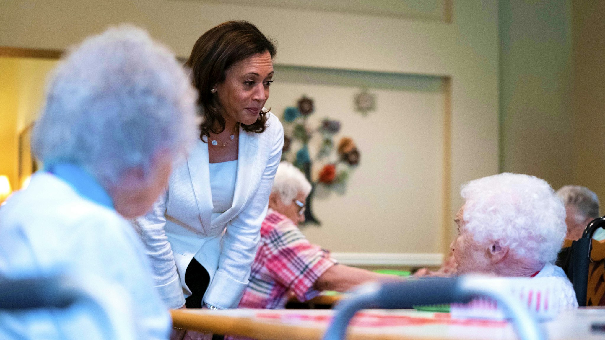 2020 Democratic Presidential hopeful Senator Kamala Harris (D-CA) greets residents and staff during a campaign stop at the Bickford Senior Living Center on August 12, 2019 in Muscatine, Iowa. - Harris finishes a multi-day bus tour across Iowa today. (Photo by Alex Edelman / AFP)