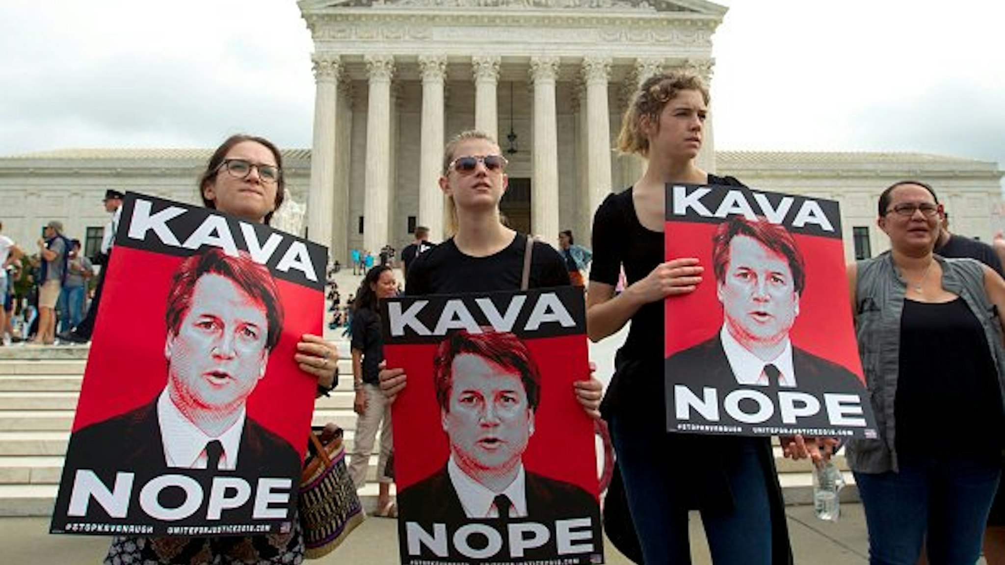 Protesters against US Supreme Court nominee Brett Kavanaugh demonstrate at the US Supreme Court in Washington, DC, on October 6, 2018.