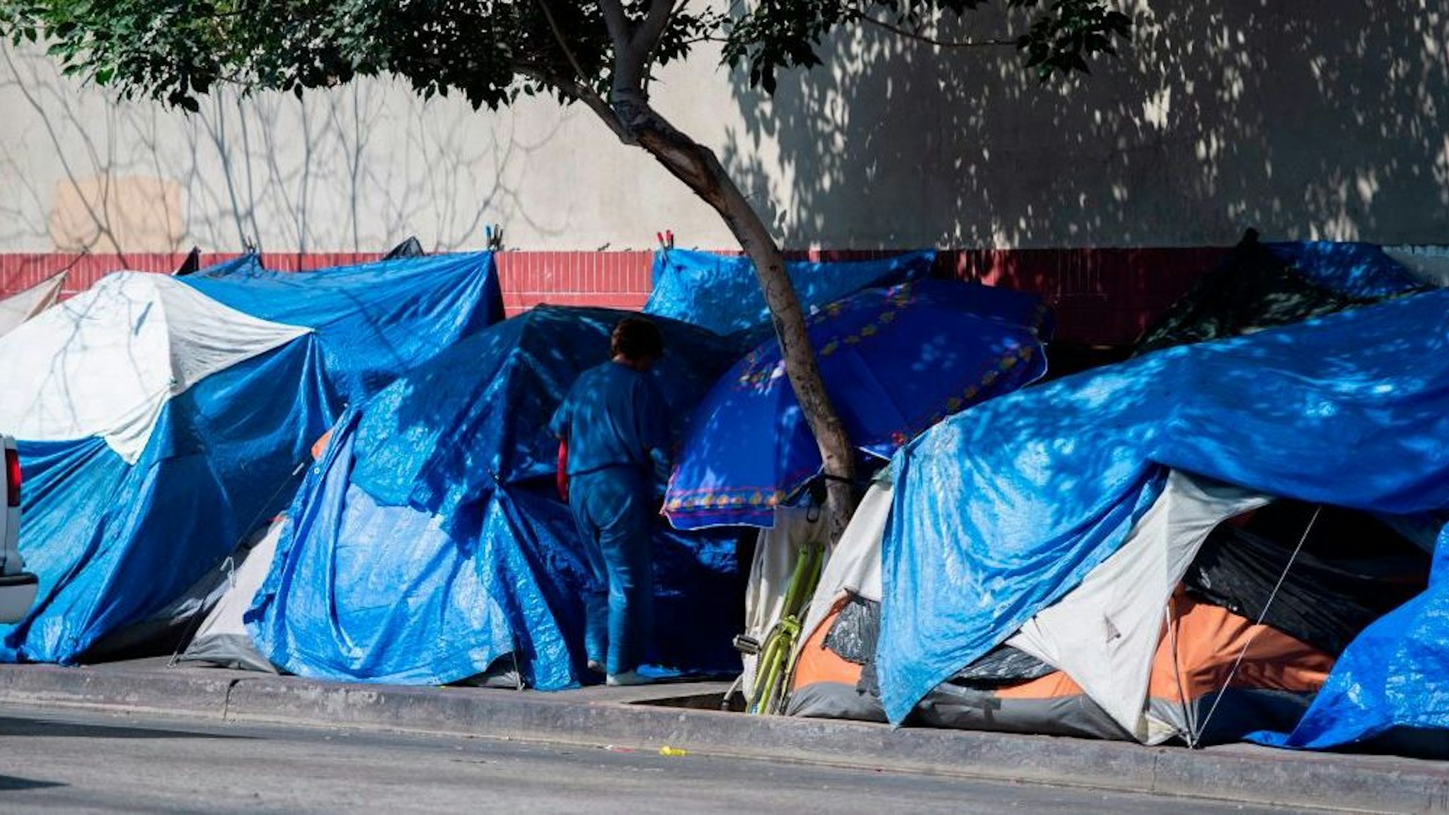 Tents line the street in Skid Row in Los Angeles, California on September 17, 2019.