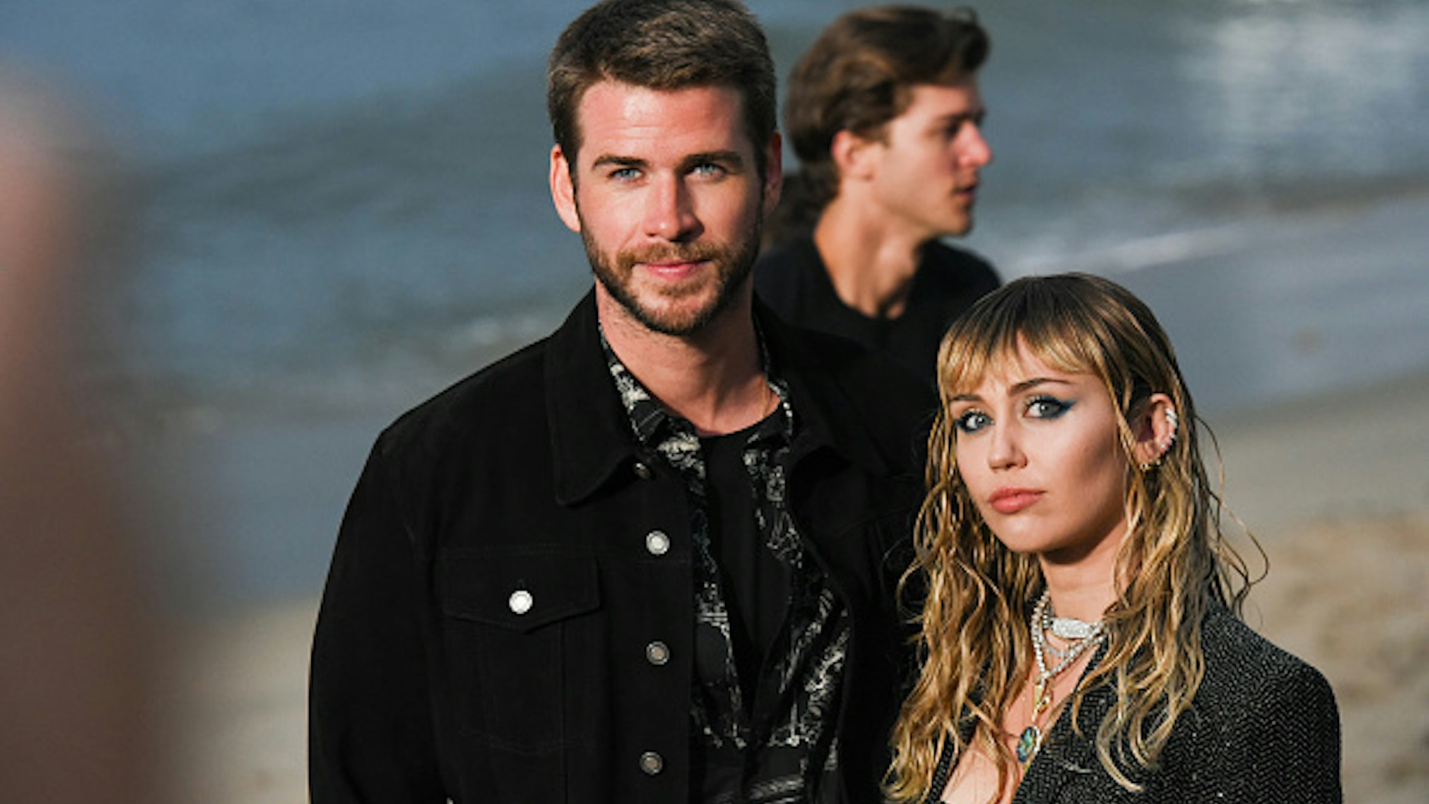MALIBU, CALIFORNIA - JUNE 06: Liam Hemsworth and Miley Cyrus at Saint Laurent mens spring summer 20 show on June 06, 2019 in Malibu, California.