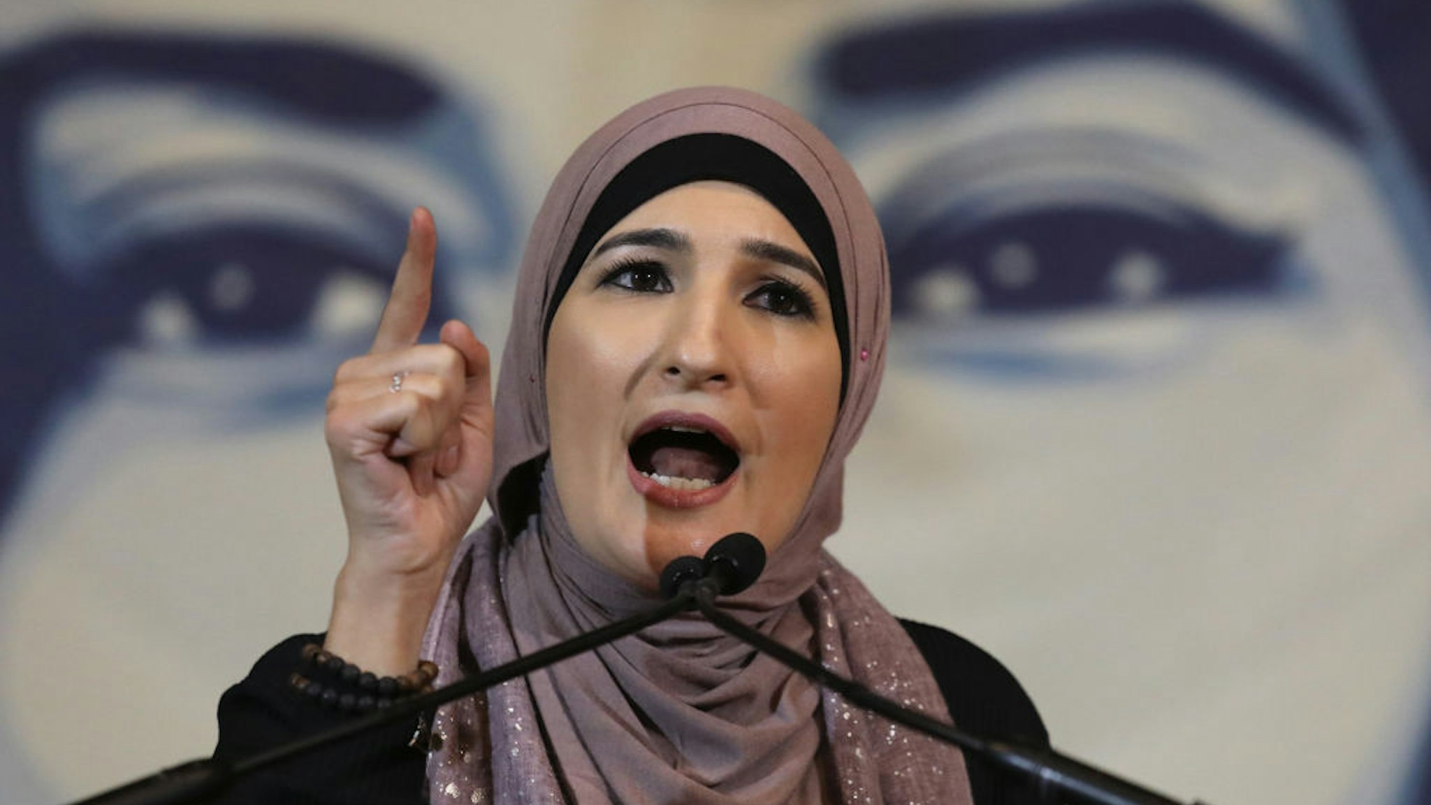 Linda Sarsour speaks during a National Day of Action for a Dream Act Now protest