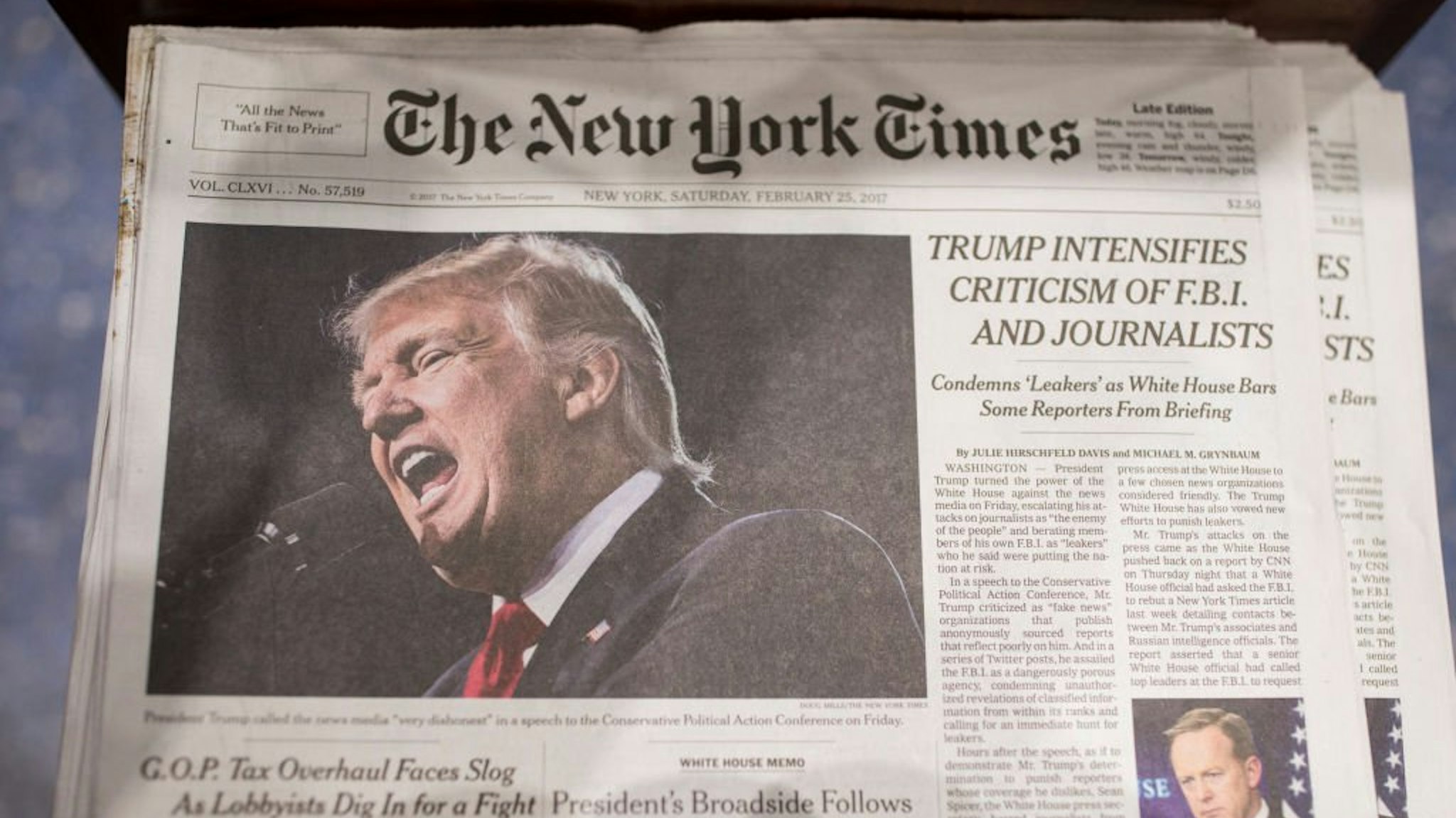 The front page of the New York Times carries a picture of President Donald Trump February 25, 2017 a day after he criticized in a speech the FBI and journalists in New York City.