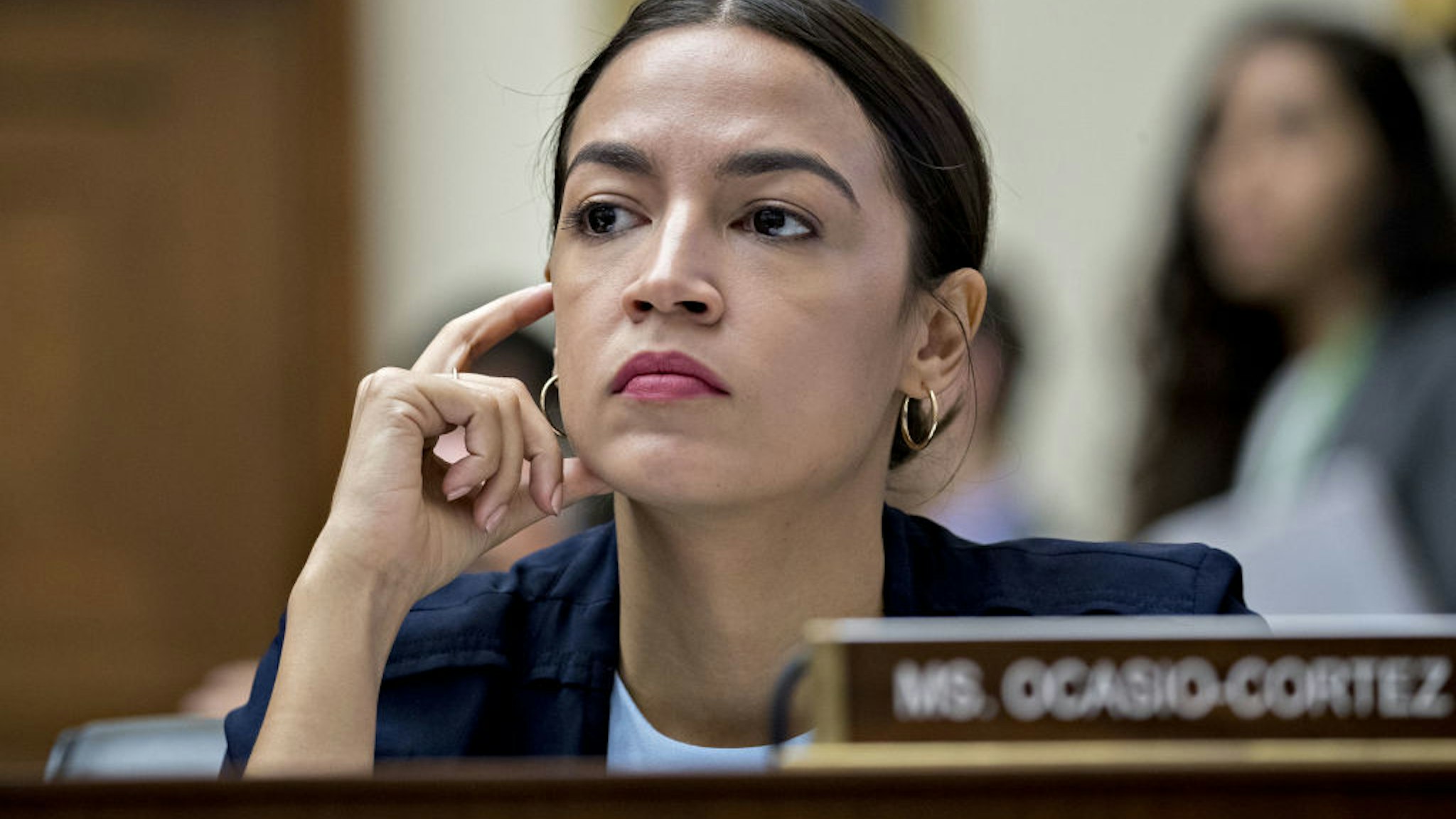 Representative Alexandria Ocasio-Cortez, a Democrat from New York, listens during a House Financial Services Committee hearing with David Marcus, head of blockchain with Facebook Inc., not pictured, in Washington, D.C., U.S., on Wednesday, July 17, 2019. Republican and Democratic Senators sharply questioned Facebook Inc.'s plan to create its own digital money, adding to a chorus of skepticism across Washington and underscoring the challenges the company faces in getting its cryptocurrency off the ground.