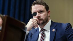 Dan Crenshaw Representative Dan Crenshaw, a Republican from Texas, listens during a House Homeland Security Committee hearing in Washington, D.C., U.S., on Wednesday, June 26, 2019.